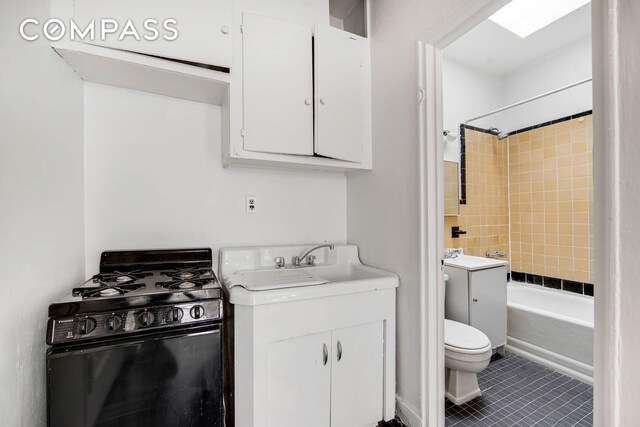 337 E 18th St, New York City, NY 10003 - full bath with toilet, tub / shower combination, tile patterned flooring, and vanity