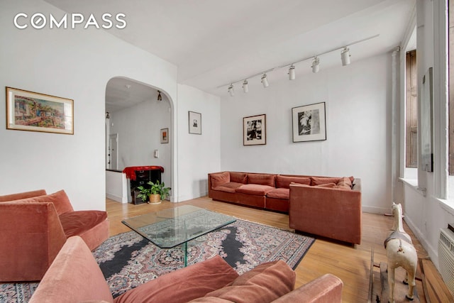 337 E 18th St, New York City, NY 10003 - living area featuring arched walkways and light wood-style flooring