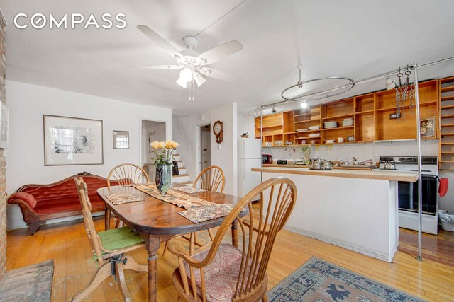 337 E 18th St, New York City, NY 10003 - dining area featuring light wood-style floors, a ceiling fan, and track lighting