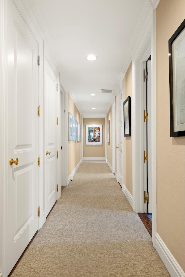 hall featuring crown molding, carpet, visible vents, recessed lighting, and baseboards