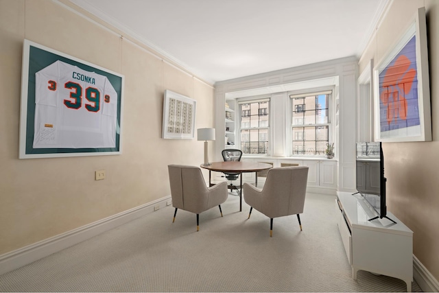 office area with baseboards, light colored carpet, and crown molding