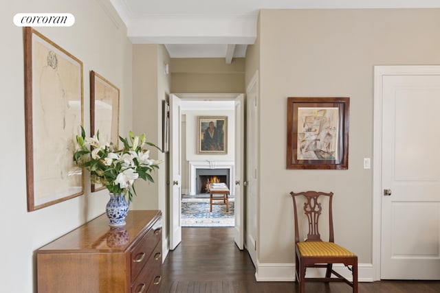 corridor with dark wood-style flooring, beamed ceiling, and baseboards