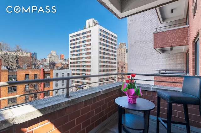 balcony featuring a city view
