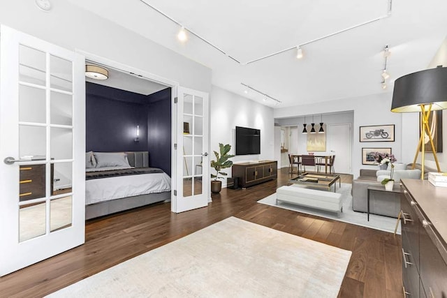 20 E 68th St Unit 5G, New York City, NY 10065 - living area featuring rail lighting, dark wood finished floors, and french doors