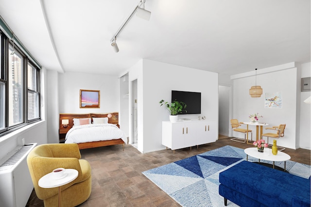 225 E 36th St Unit 11R, New York City, NY 10016 - bedroom with radiator and stone finish flooring