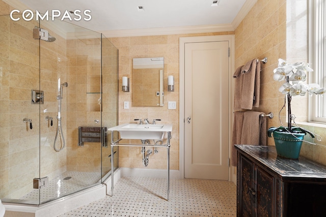 bathroom featuring tile walls, ornamental molding, and a stall shower