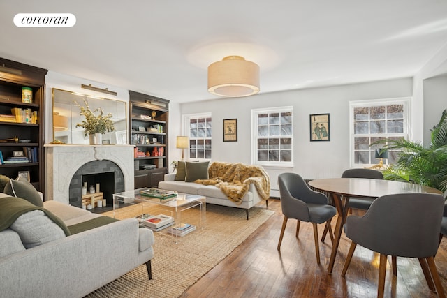 443 W 24th St Unit G, New York City, NY 10011 - living area with a premium fireplace and hardwood / wood-style floors