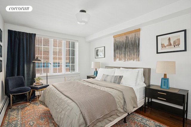 443 W 24th St Unit G, New York City, NY 10011 - bedroom with wood finished floors and baseboard heating