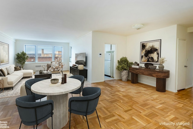 3750 Hudson Manor Ter Unit 6Hw, New York City, NY 10463 - dining area featuring radiator, baseboards, and crown molding