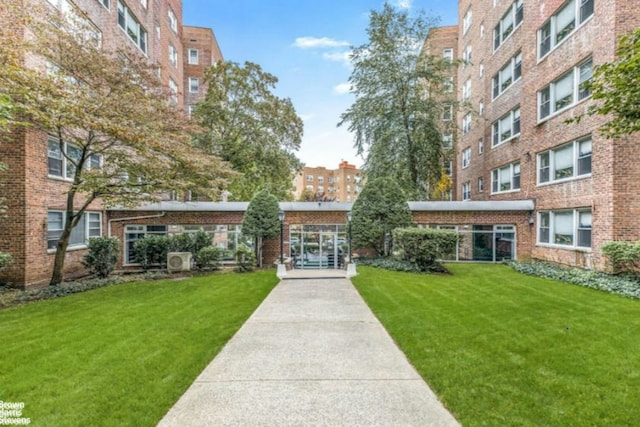 view of home's community featuring a lawn