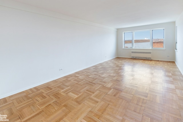 3750 Hudson Manor Ter Unit 6Hw, New York City, NY 10463 - empty room with radiator heating unit and baseboards