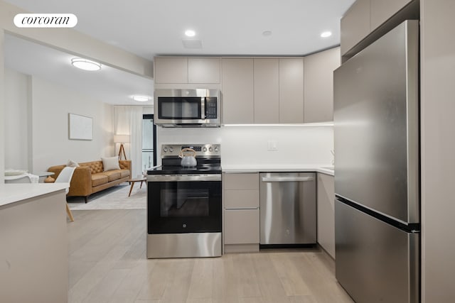 608 Ocean Ave Unit 202, New York City, NY 11226 - kitchen featuring stainless steel appliances, modern cabinets, light countertops, and gray cabinetry