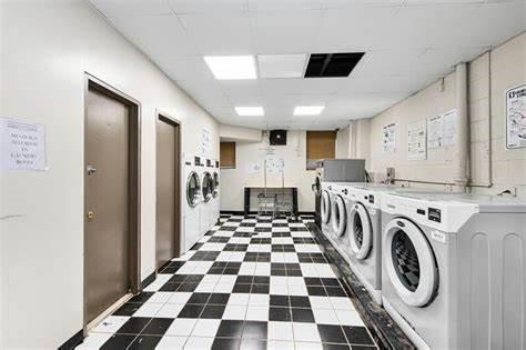 12399 Flatlands Ave Unit 6L, New York City, NY 11207 - common laundry area with washing machine and dryer and visible vents