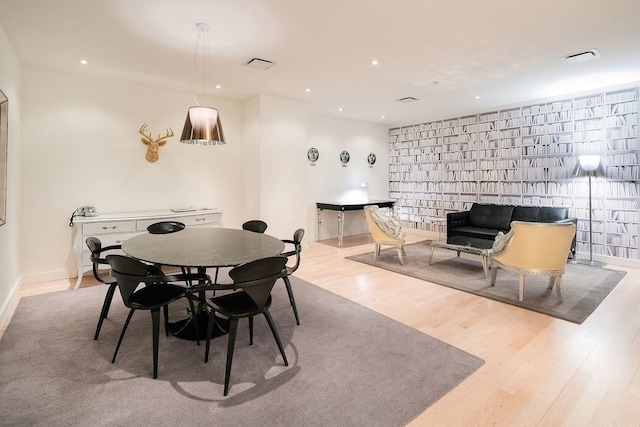 dining space with recessed lighting, wood finished floors, visible vents, and baseboards