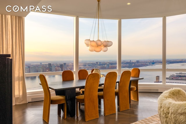 dining area featuring a city view and plenty of natural light