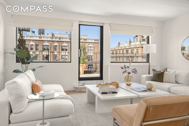 1049 Park Ave Ph, Ph, New York City, NY 10028 - living area featuring light wood-style flooring and baseboards