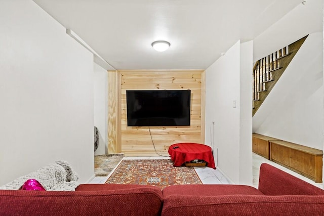 living room featuring stairs