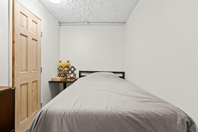bedroom featuring a textured ceiling