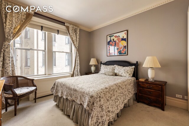 875 Park Ave Unit 9C, New York City, NY 10075 - bedroom with light colored carpet, multiple windows, and ornamental molding