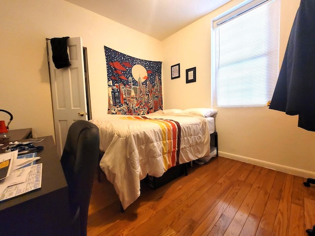 21-05 33rd St Unit 1-G, New York City, NY 11105 - bedroom featuring wood-type flooring and baseboards