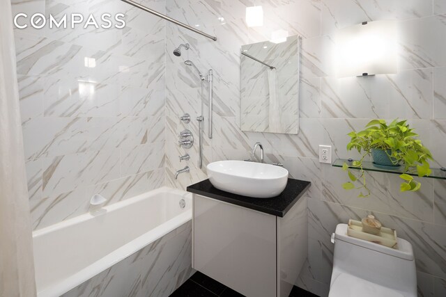 59 John St Unit Ph1, New York City, NY 10038 - bathroom featuring tile walls, vanity, shower / washtub combination, and toilet