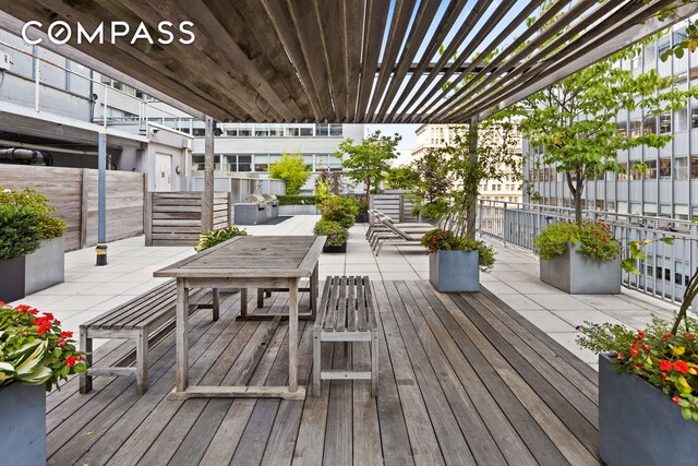 59 John St Unit Ph1, New York City, NY 10038 - wooden terrace featuring a pergola and outdoor dining area