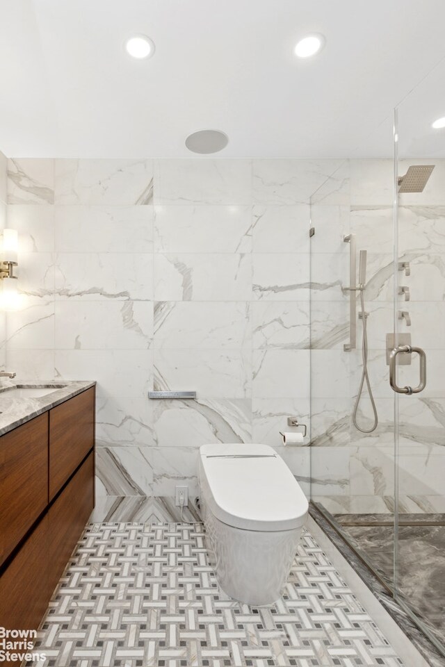 115 E 9th St Unit 8Lm, New York City, NY 10003 - bathroom with a marble finish shower, recessed lighting, and vanity