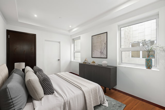 135 W 4th St Unit 3W, New York City, NY 10012 - bedroom featuring a raised ceiling, wood finished floors, recessed lighting, and baseboards