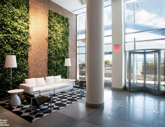 common area featuring a high ceiling and expansive windows