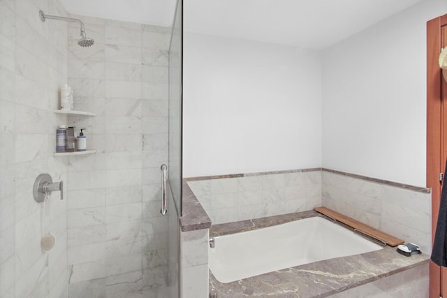 full bath featuring a shower stall and a bath