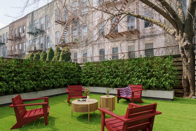307 Cooper St Unit 1B, New York City, NY 11237 - view of community featuring a lawn