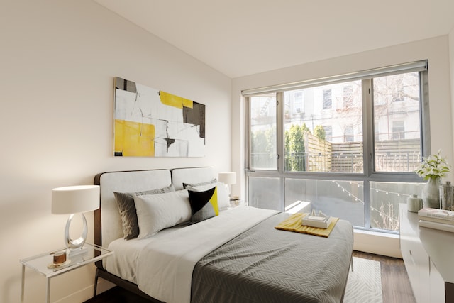 307 Cooper St Unit 1B, New York City, NY 11237 - bedroom with wood finished floors and multiple windows