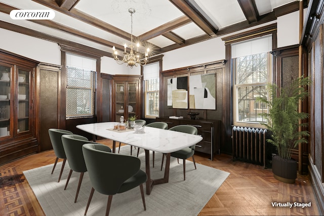 dining space with visible vents, a notable chandelier, coffered ceiling, radiator heating unit, and beamed ceiling