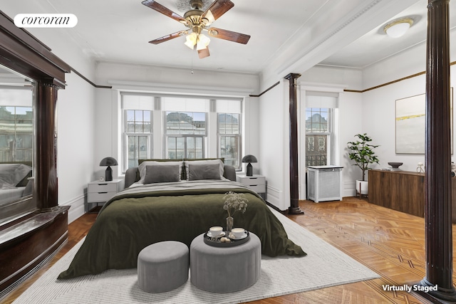 bedroom featuring a ceiling fan, visible vents, ornate columns, and crown molding