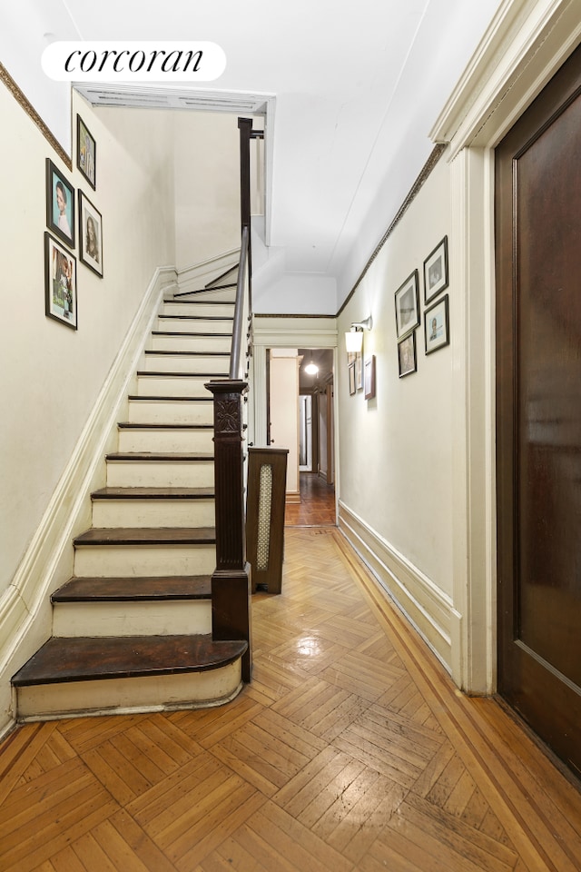 stairway featuring baseboards