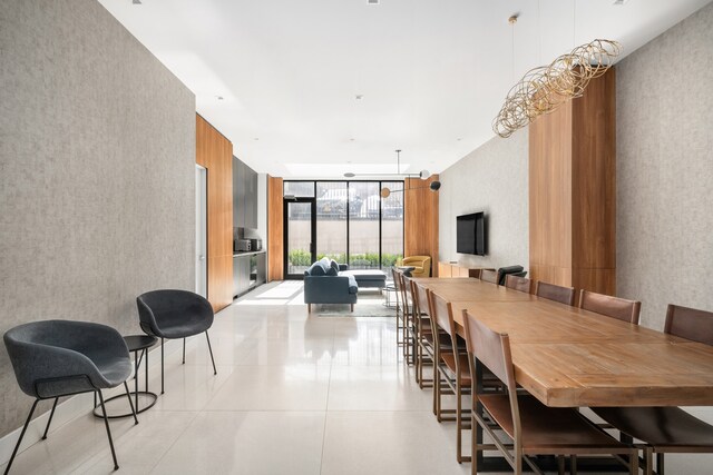 269 4th Ave Unit 403, New York City, NY 11215 - dining area with expansive windows, wallpapered walls, and light tile patterned flooring