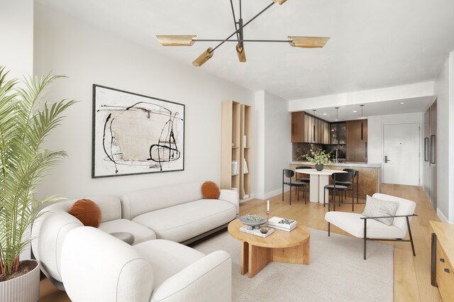 269 4th Ave Unit 403, New York City, NY 11215 - living area with light wood finished floors, a chandelier, and baseboards