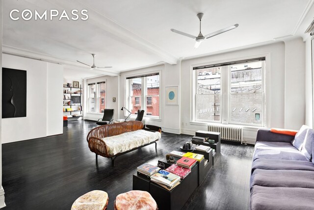 366 Broadway Unit 5C, New York City, NY 10013 - living area featuring a ceiling fan, radiator, wood finished floors, and beamed ceiling