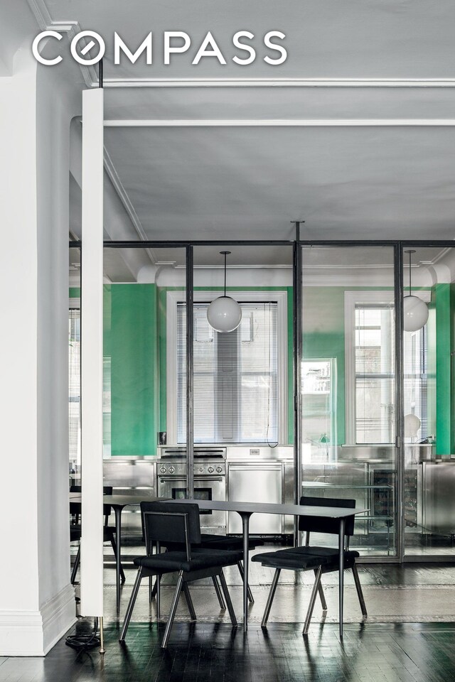 366 Broadway Unit 5C, New York City, NY 10013 - dining room featuring wood finished floors and crown molding