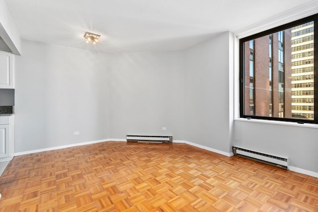 1619 3rd Ave Unit 21F, New York City, NY 10128 - unfurnished room featuring a baseboard radiator, baseboard heating, and baseboards