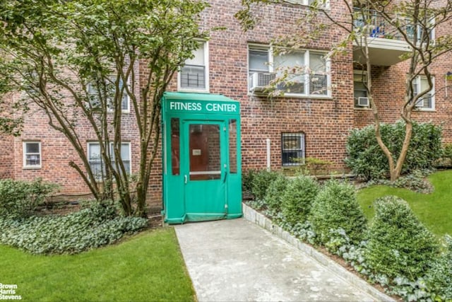 property entrance featuring brick siding