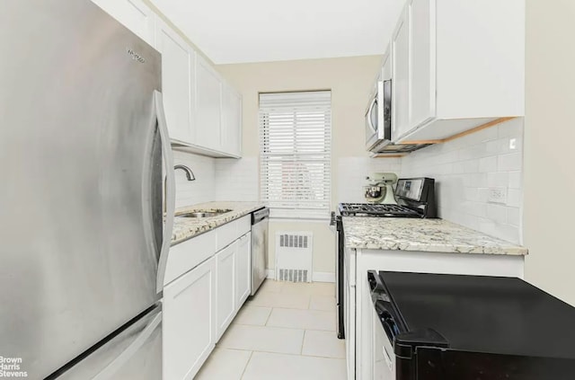 3750 Hudson Manor Ter Unit 6De, New York City, NY 10463 - kitchen with stainless steel appliances, a sink, tasteful backsplash, and white cabinetry