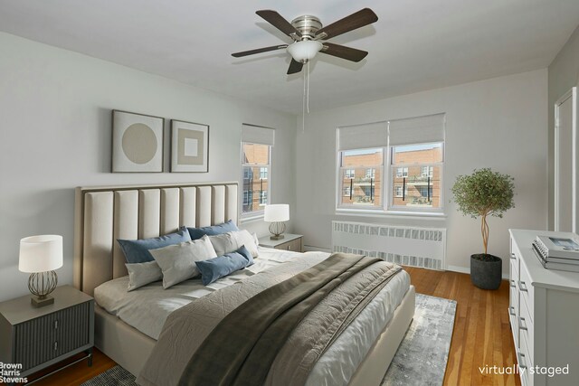 3750 Hudson Manor Ter Unit 6De, New York City, NY 10463 - bedroom with radiator, wood finished floors, baseboards, and ceiling fan