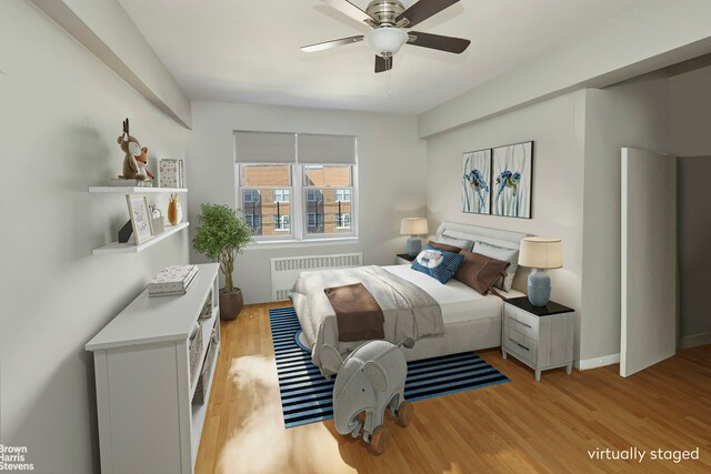 3750 Hudson Manor Ter Unit 6De, New York City, NY 10463 - bedroom featuring radiator heating unit, light wood-type flooring, and a ceiling fan