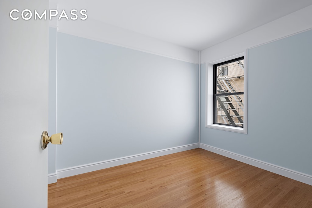 87 Barrow St Unit 5E, New York City, NY 10014 - spare room featuring light wood-type flooring and baseboards