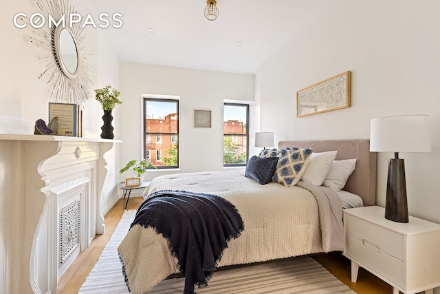 bedroom featuring light wood finished floors