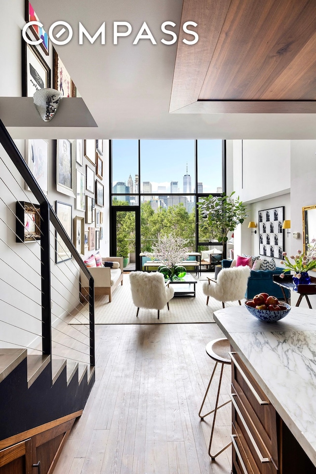 90 Furman St Unit N510, New York City, NY 11201 - common area with floor to ceiling windows, stairs, and wood ceiling