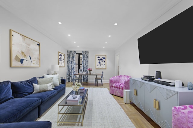 living room with crown molding and recessed lighting