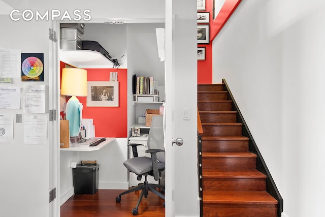 stairway with wood finished floors