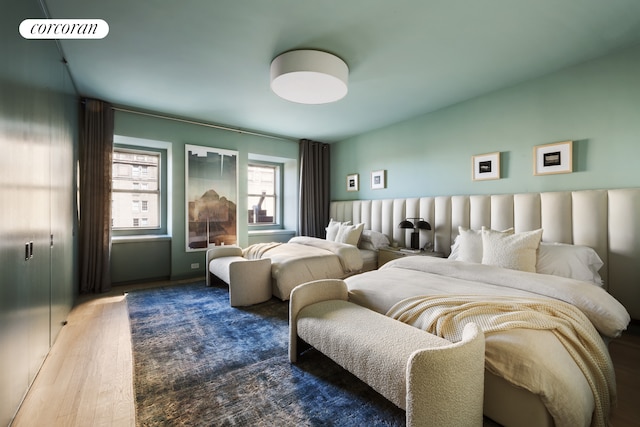 bedroom featuring wood finished floors